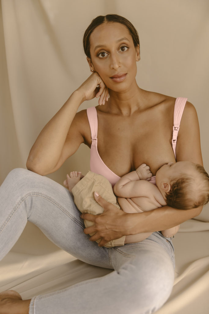 Breastfeeding mother wearing the Nurture nursing bra